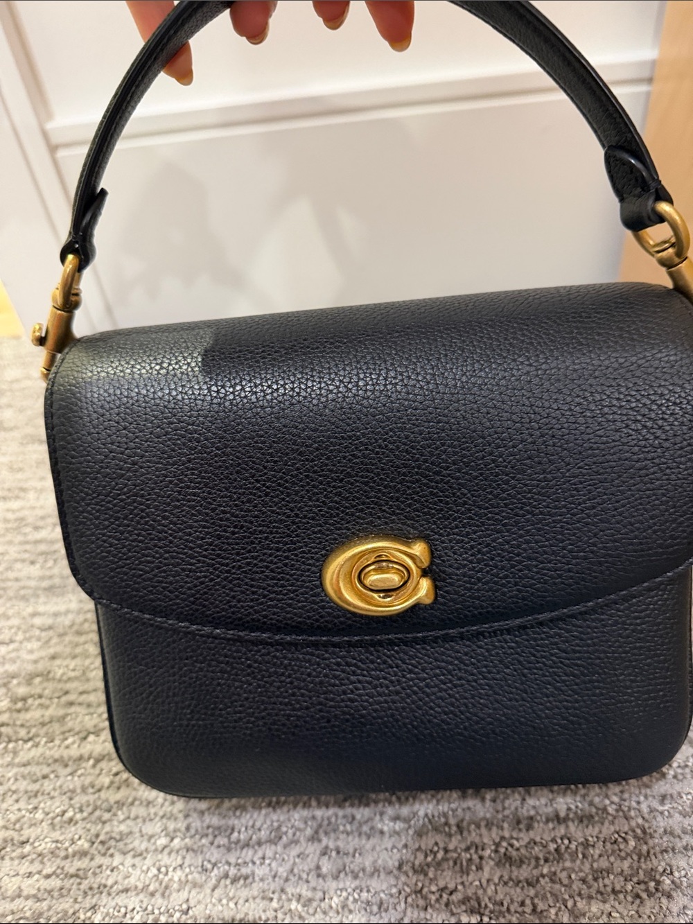 Coach Mini Cassie in Black Pebbled Leather with Top Handle and Gold Hardware